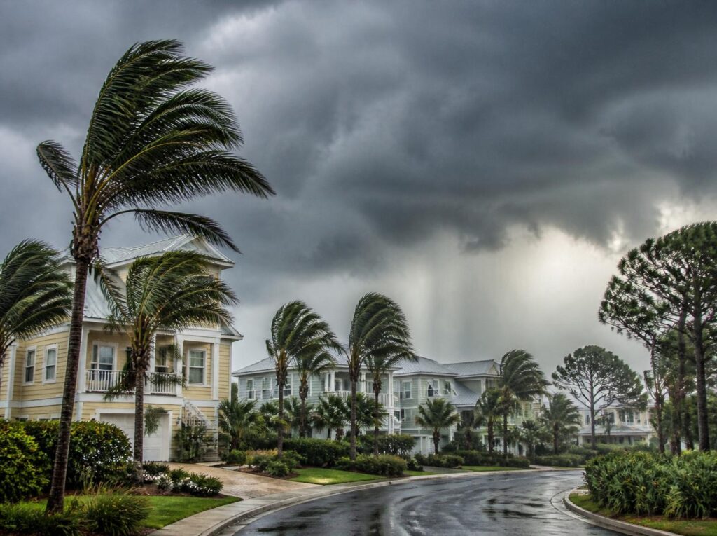 Florida Panhandle neighborhood under dark tropical storm clouds as Tropical Storm Isaias approaches.
